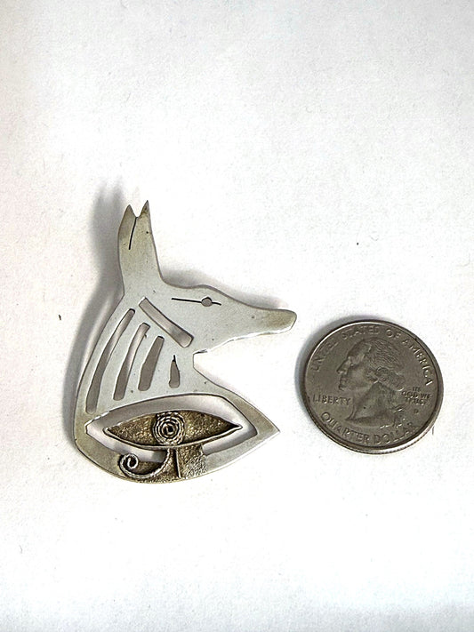 Hand-pierced sterling silver Anubis jackal-head pendant, front view