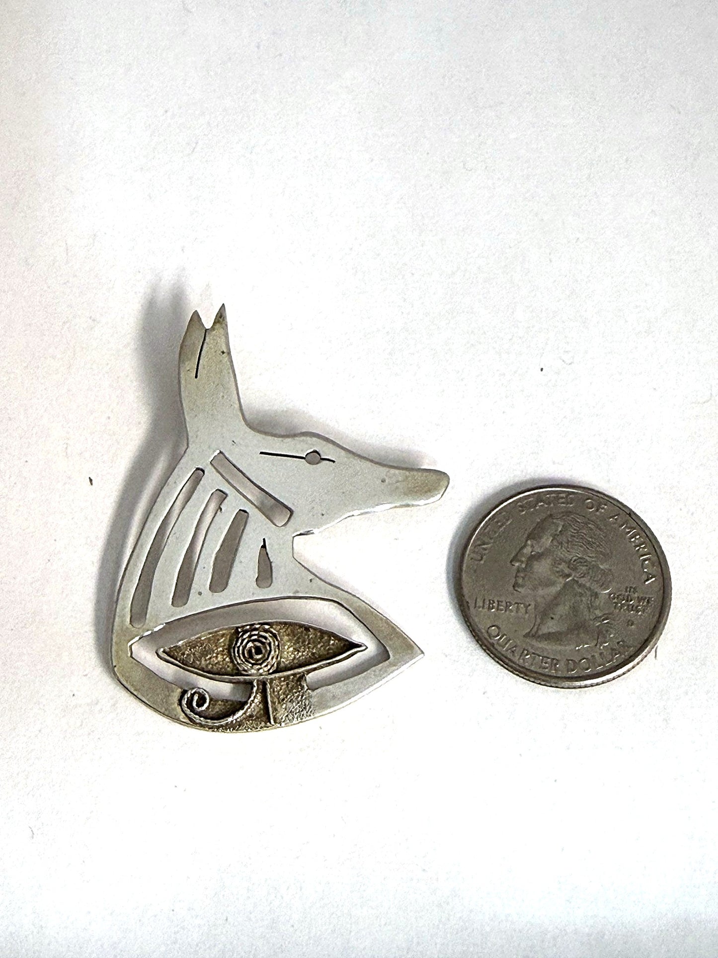 Hand-pierced sterling silver Anubis jackal-head pendant, front view