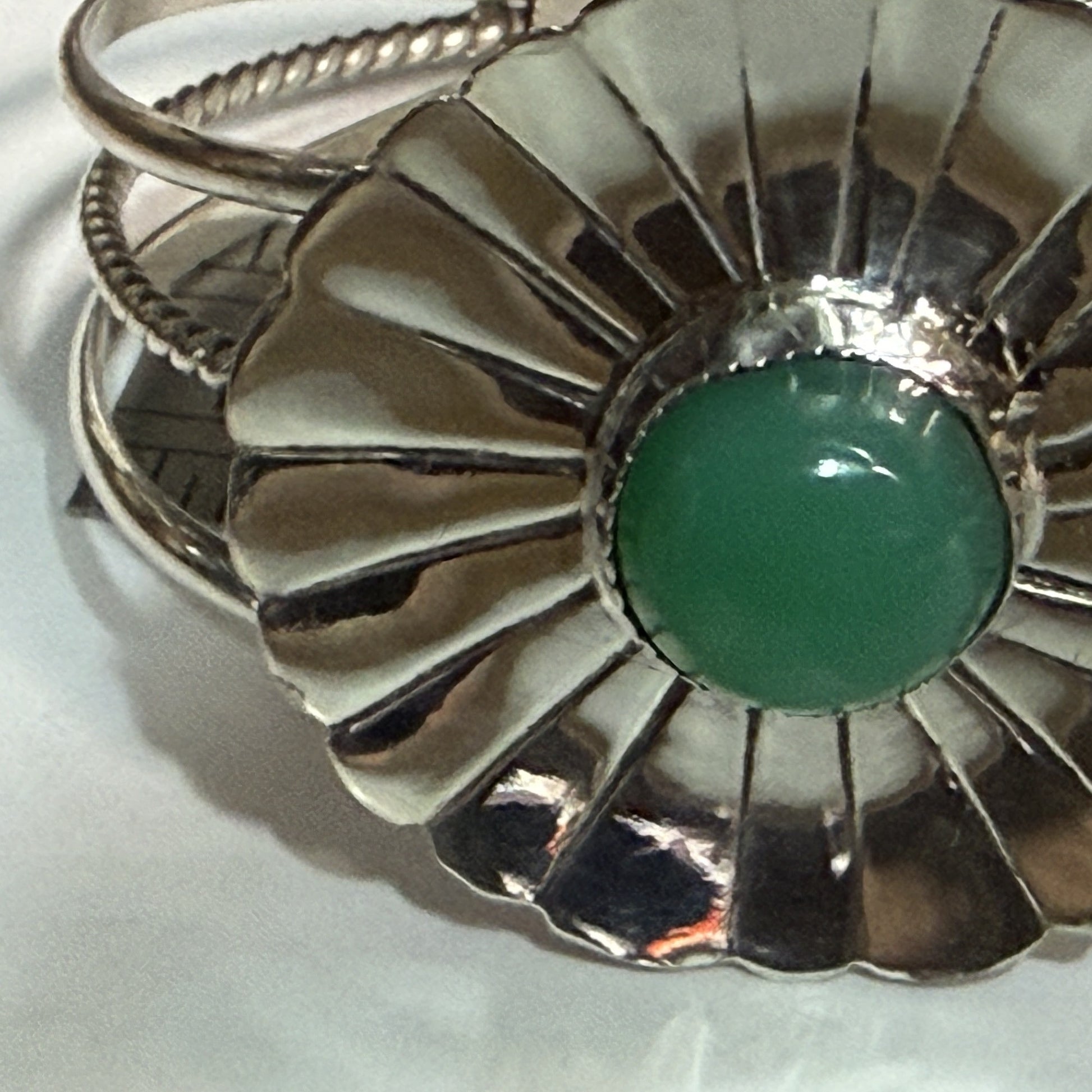 Sterling silver fluted concha cuff bracelet with a green chrysoprase cabochon
