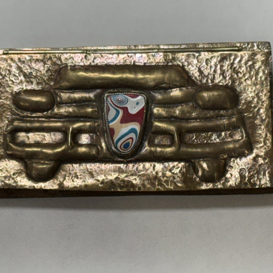 Repoussé brass box hand-sculpted as a 1950s car grille with a fordite badge
