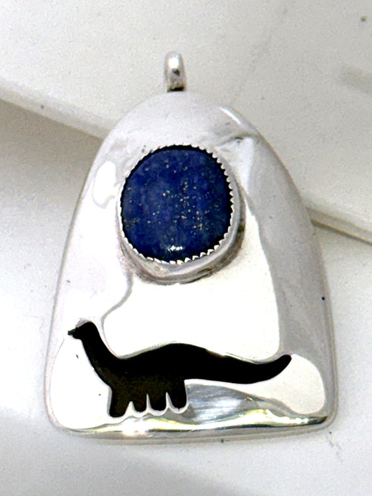 Macro detail of the deep-blue lapis lazuli cabochon and bezel setting