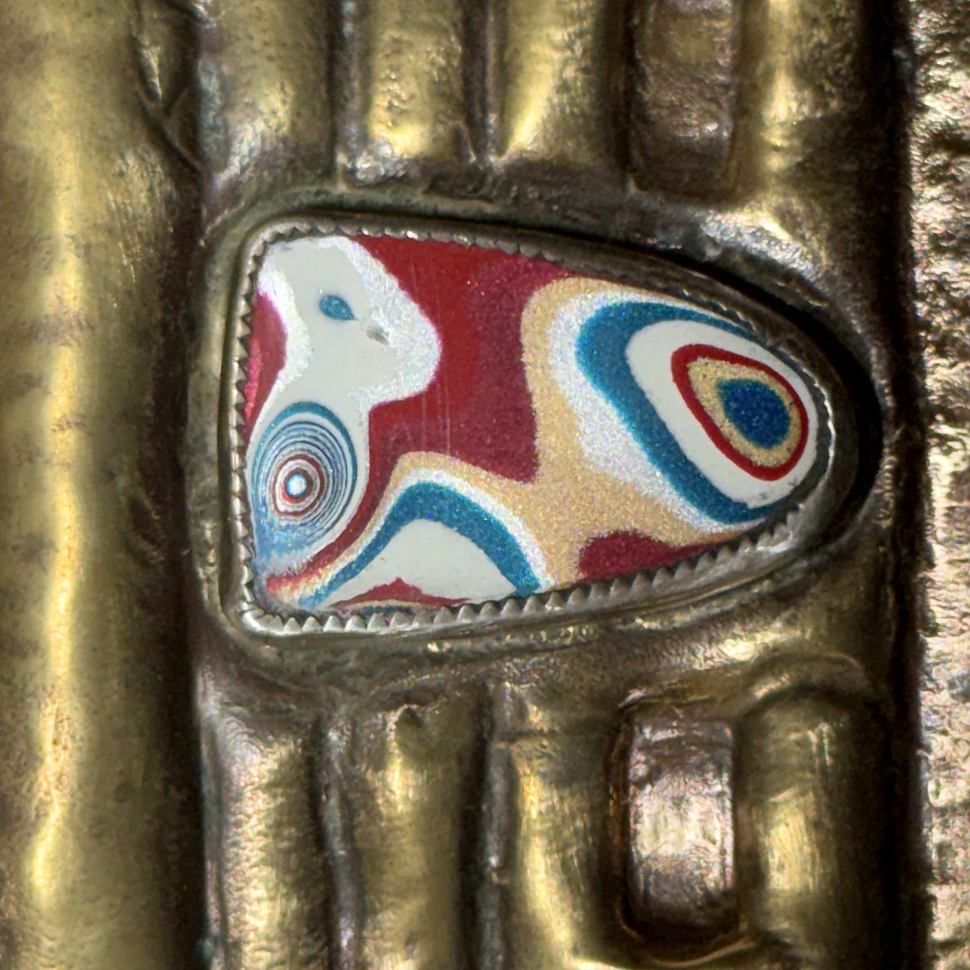 Fordite grille badge set into the hand-sculpted brass car grille