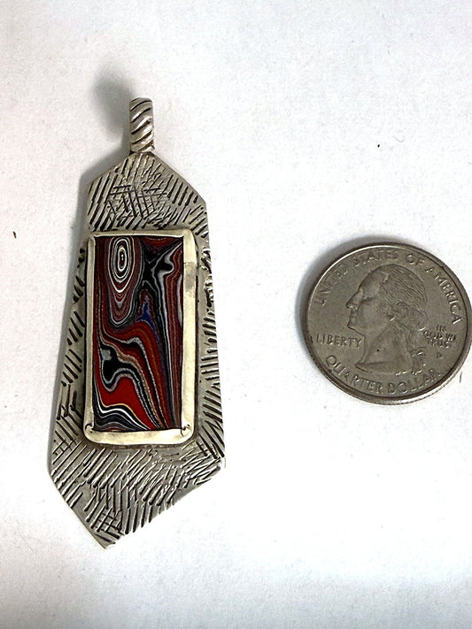 Sterling silver fordite Detroit agate bar pendant with hand-stamped border, front view