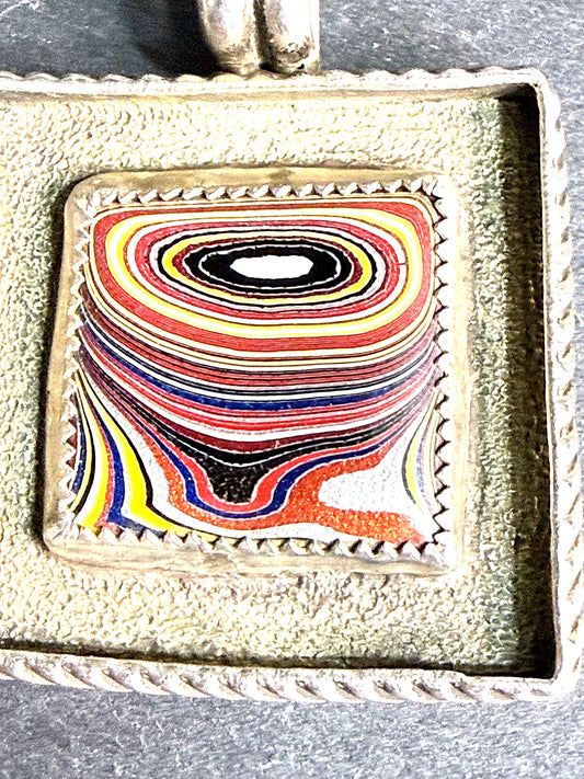 Macro detail of the concentric fordite eye pattern