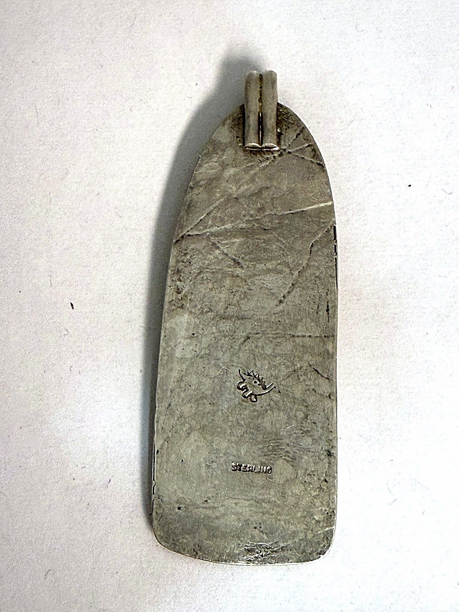 Reverse of the sterling silver fordite pendant showing the hallmark